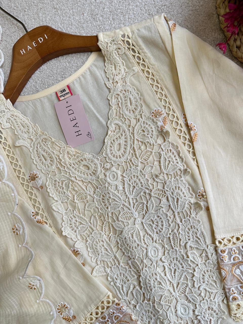 19257 Beautiful embroidered suit with lace detailing